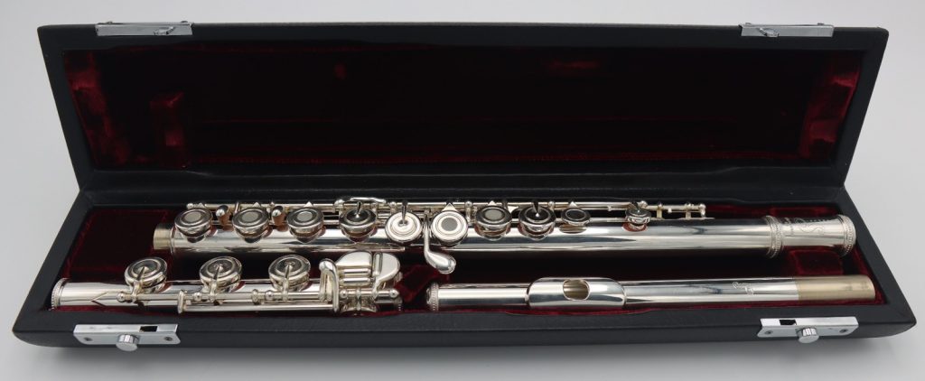 Samperi Harmonic flute displayed in open black velvet-lined case
