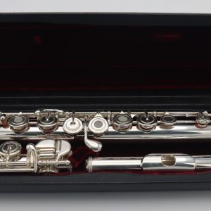 Samperi Harmonic flute displayed in open black velvet-lined case