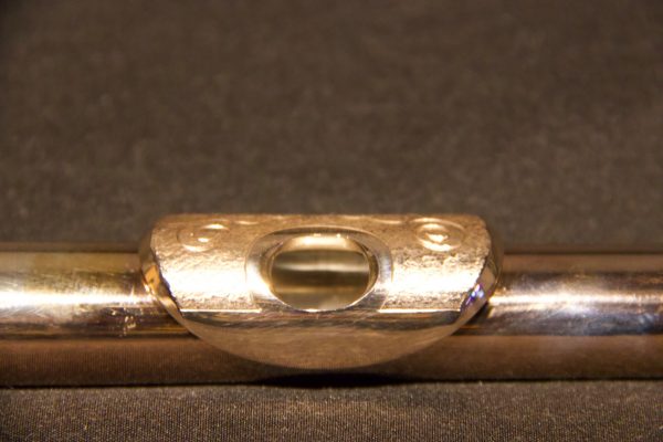 Front view of engraved lip plate on gold-plated Jeff Weissman silver headjoint