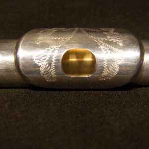 Detail of engraved lip plate on Jeff Weissman solid silver flute headjoint