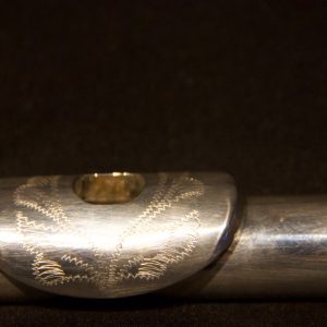 Angled side view of Jeff Weissman solid silver headjoint with engraving