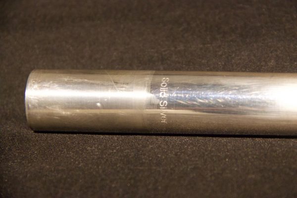 Close-up of solid silver tube with engraving on Jeff Weissman headjoint