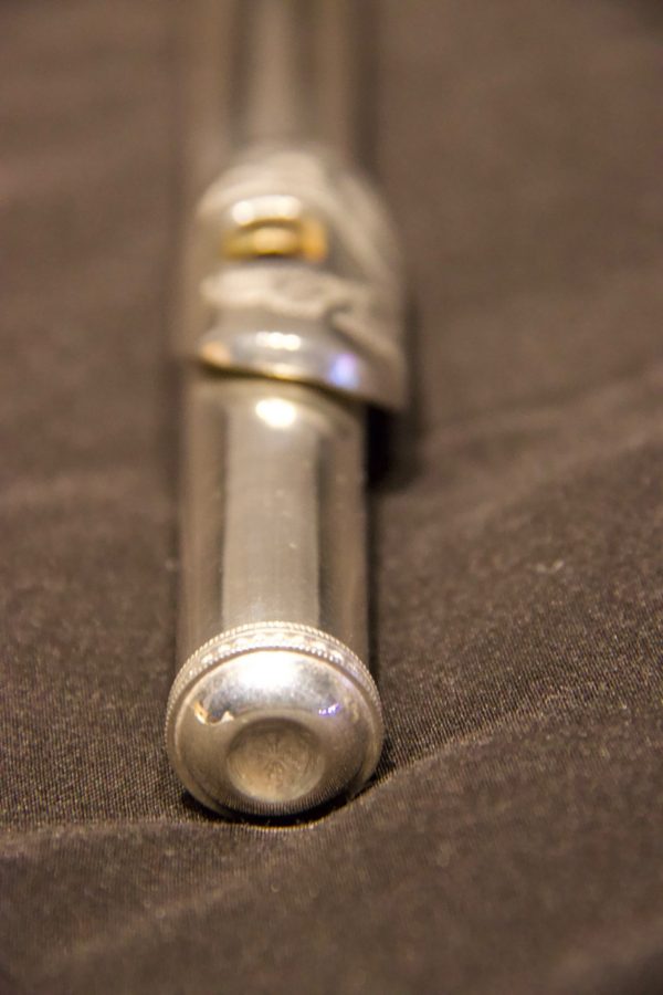 Perspective shot of Jeff Weissman solid silver flute headjoint with alternate engraved lip plate