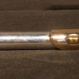 Detailed side angle of Weissman McKenna silver flute headjoint with gold lip plate