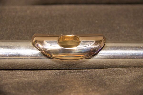 Front view of gold lip plate on Weissman McKenna silver flute headjoint