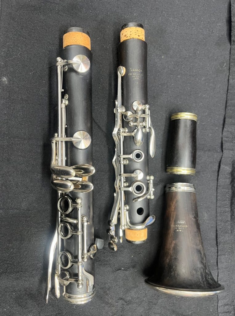 Yamaha wood clarinet body, upper joint, barrel and bell disassembled for inspection