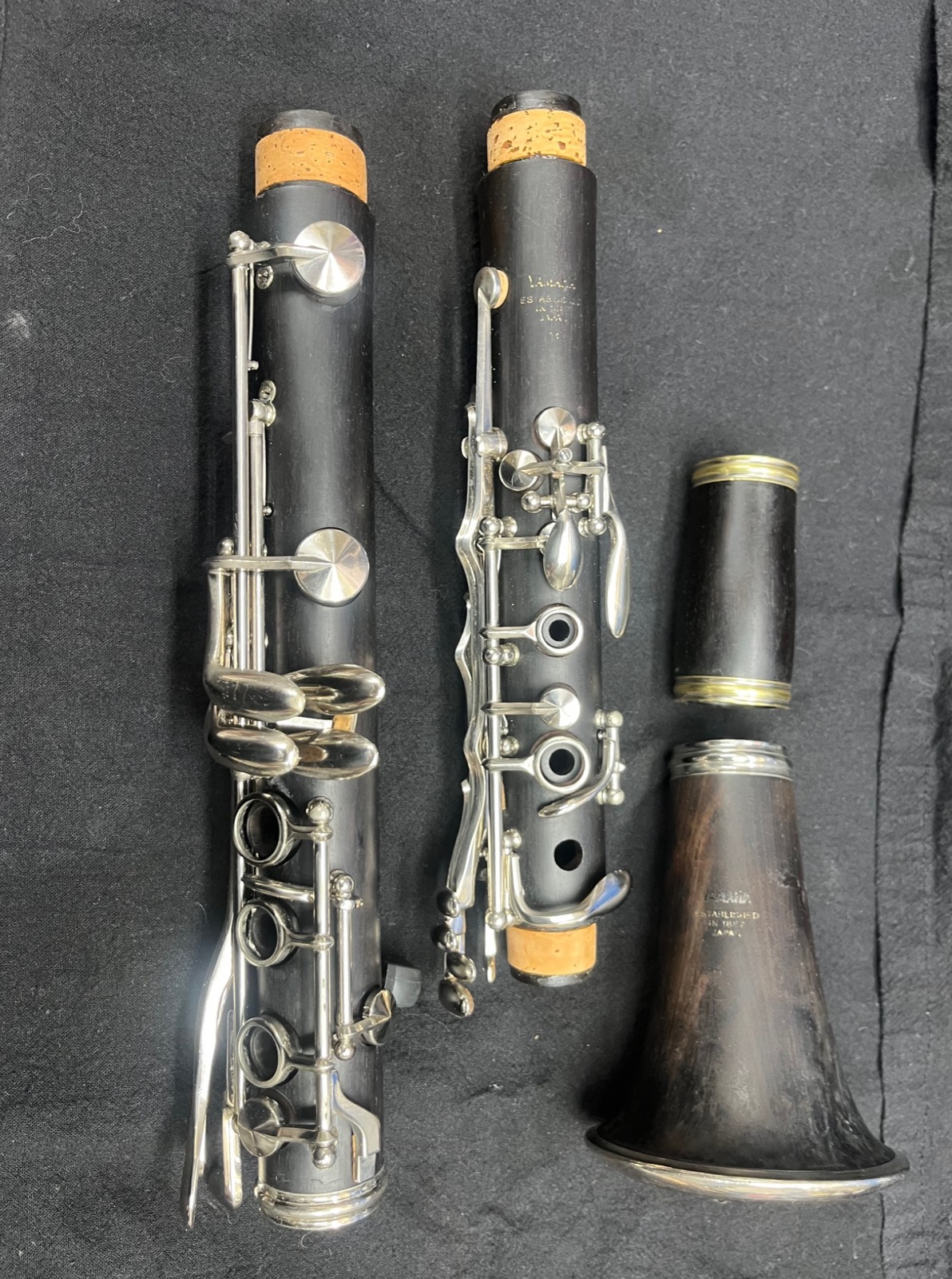 Yamaha wood clarinet body, upper joint, barrel and bell disassembled for inspection