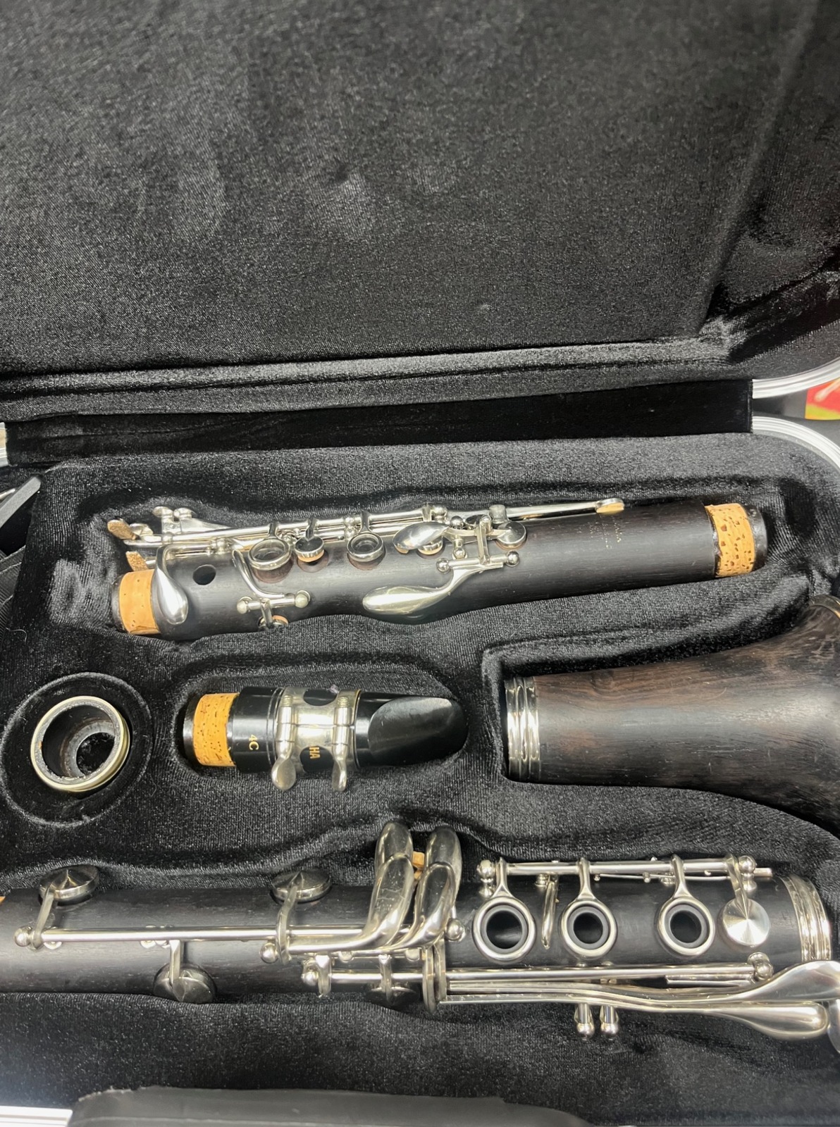 Yamaha wood clarinet in its hard case with mouthpiece, barrel and bell